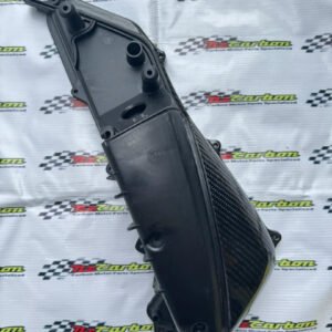 NZ Carbon Air Filter Cover 1 for Yamaha XMAX V1, V2 & V3 in Black Twill Carbon, displayed on a branded NZ Motor Parts background showing the carbon weave and detailed craftsmanship.