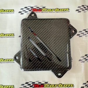 Engine Clutch Cover in Black Twill Carbon for Yamaha XMAX V1, V2 & V3, displayed on a branded NZ Motor Parts background, showing the carbon fiber weave and glossy finish.