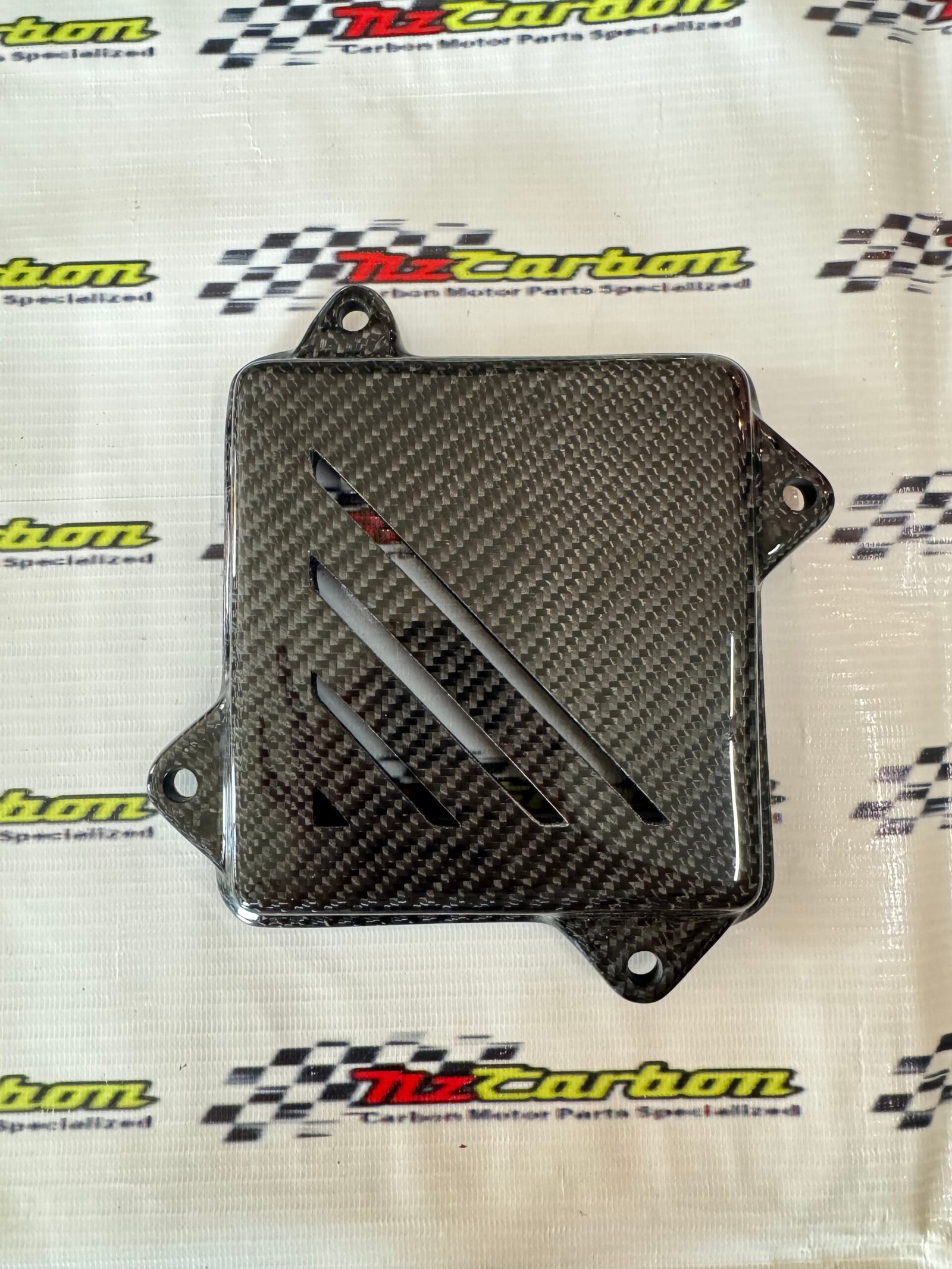 Engine Clutch Cover in Black Twill Carbon for Yamaha XMAX V1, V2 & V3, displayed on a branded NZ Motor Parts background, showing the carbon fiber weave and glossy finish.