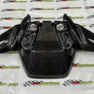 Big Twill Carbon Front Signal Cover for Yamaha XMAX V2 displayed on an NZ Motor Parts branded background, showing the large carbon weave pattern and glossy finish.