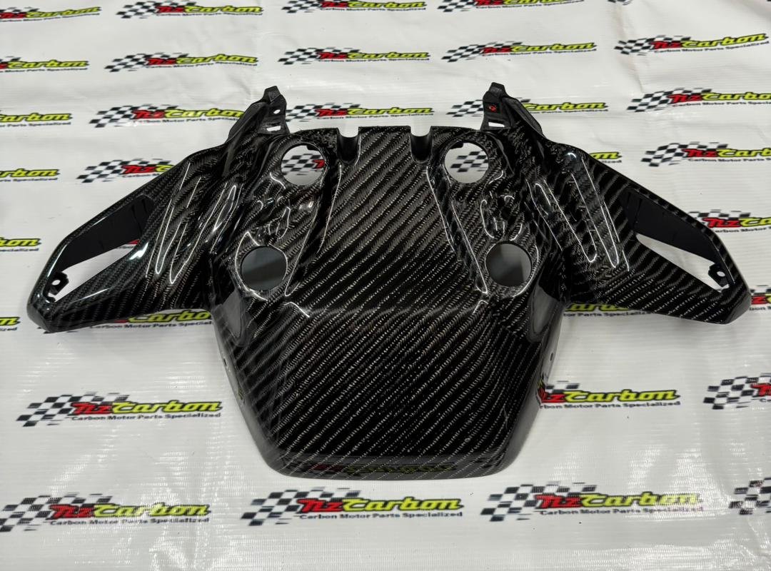 Big Twill Carbon Front Signal Cover for Yamaha XMAX V2 displayed on an NZ Motor Parts branded background, showing the large carbon weave pattern and glossy finish.