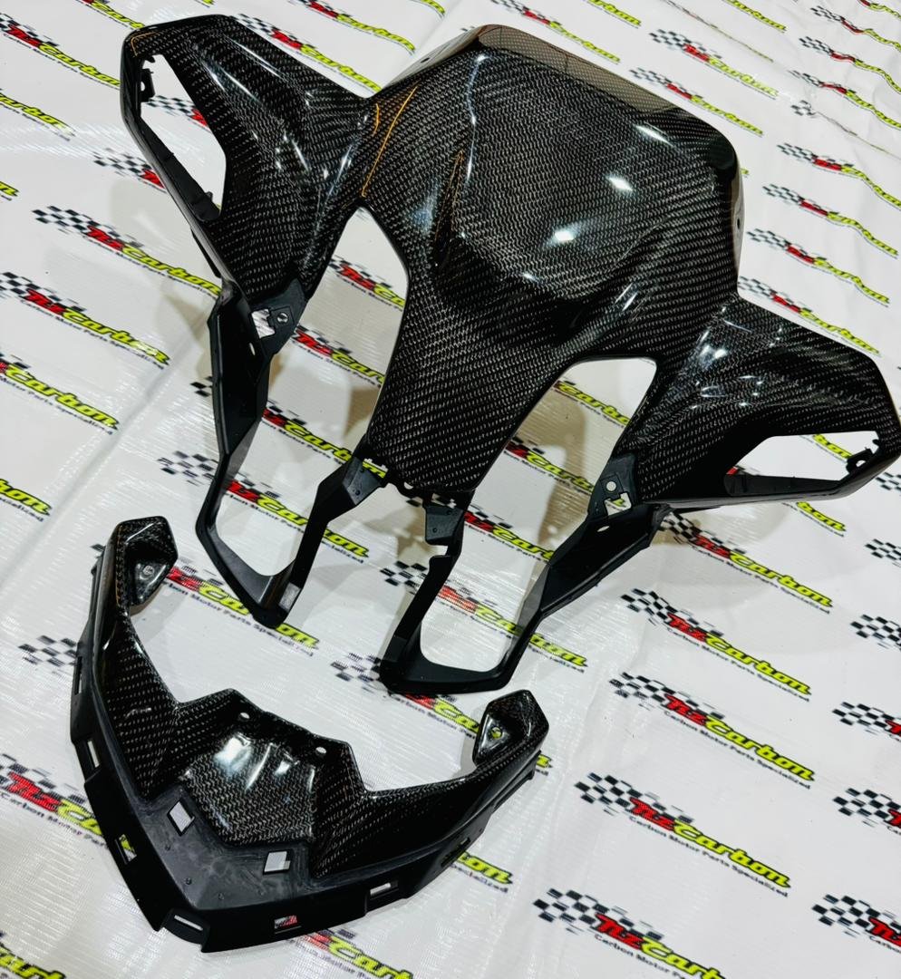A complete NZ Carbon Front Signal Cover Set for Yamaha XMAX V3 in Black Twill Carbon, including the Front Signal Cover and Upper Front Signal Cover displayed on an NZ Motor Parts branded backdrop.
