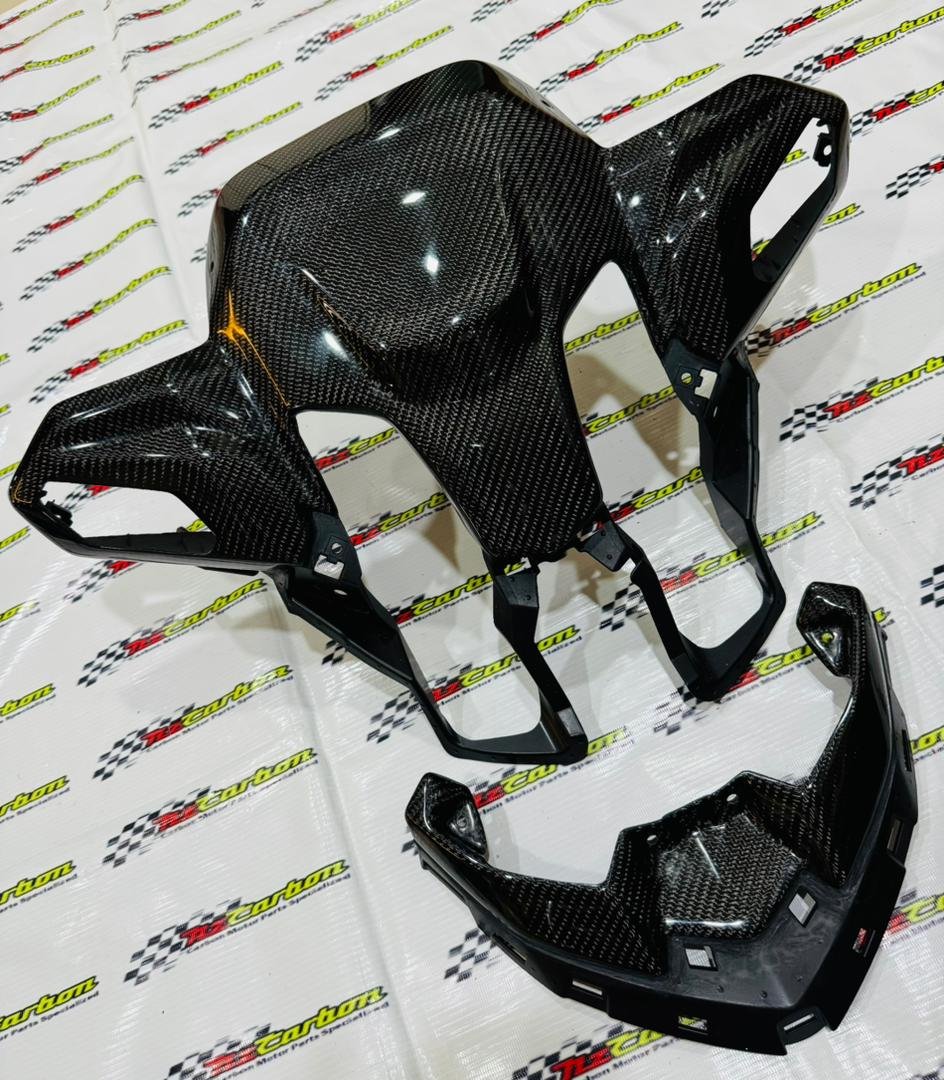 A complete NZ Carbon Front Signal Cover Set for Yamaha XMAX V3 in Black Twill Carbon, including the Front Signal Cover and Upper Front Signal Cover displayed on an NZ Motor Parts branded backdrop.