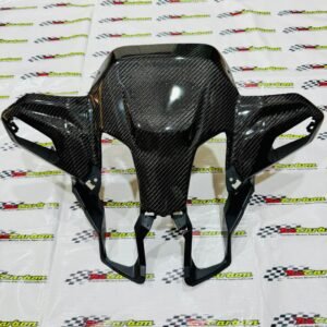 Black Twill Carbon Front Signal Cover for Yamaha XMAX V3, shown on an NZ Motor Parts branded surface, displaying the carbon weave texture and aerodynamic design.