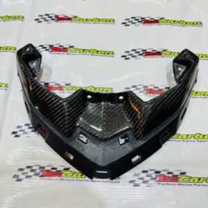 Upper Front Signal Cover in Black Twill Carbon for Yamaha XMAX V3, displayed on an NZ Carbon / NZ Motor Parts branded background showing the carbon fiber texture and detailed craftsmanship.