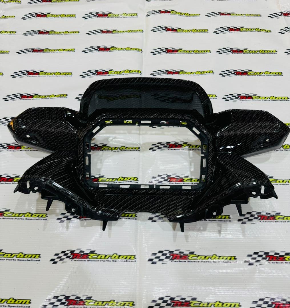 Black Twill Carbon Cover Meter Panel for Yamaha XMAX V3, displayed on an NZ Carbon background showing the detailed carbon weave and curved design.