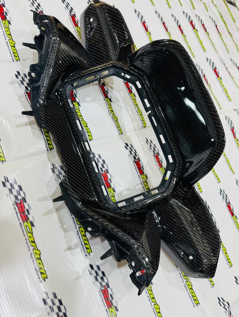 Black Twill Carbon Cover Meter Panel for Yamaha XMAX V3, displayed on an NZ Carbon background showing the detailed carbon weave and curved design.