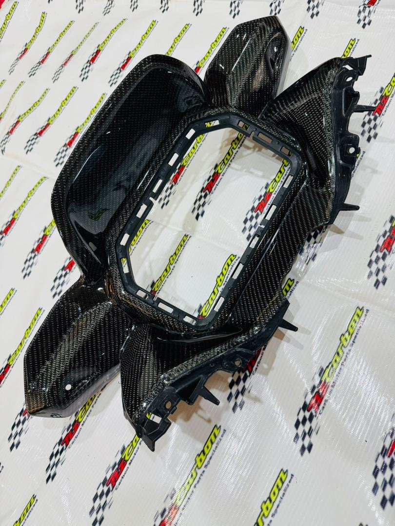 Black Twill Carbon Cover Meter Panel for Yamaha XMAX V3, displayed on an NZ Carbon background showing the detailed carbon weave and curved design.