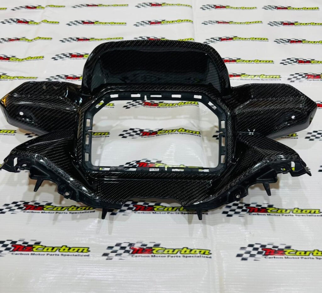 Black Twill Carbon Cover Meter Panel for Yamaha XMAX V3, displayed on an NZ Carbon background showing the detailed carbon weave and curved design.