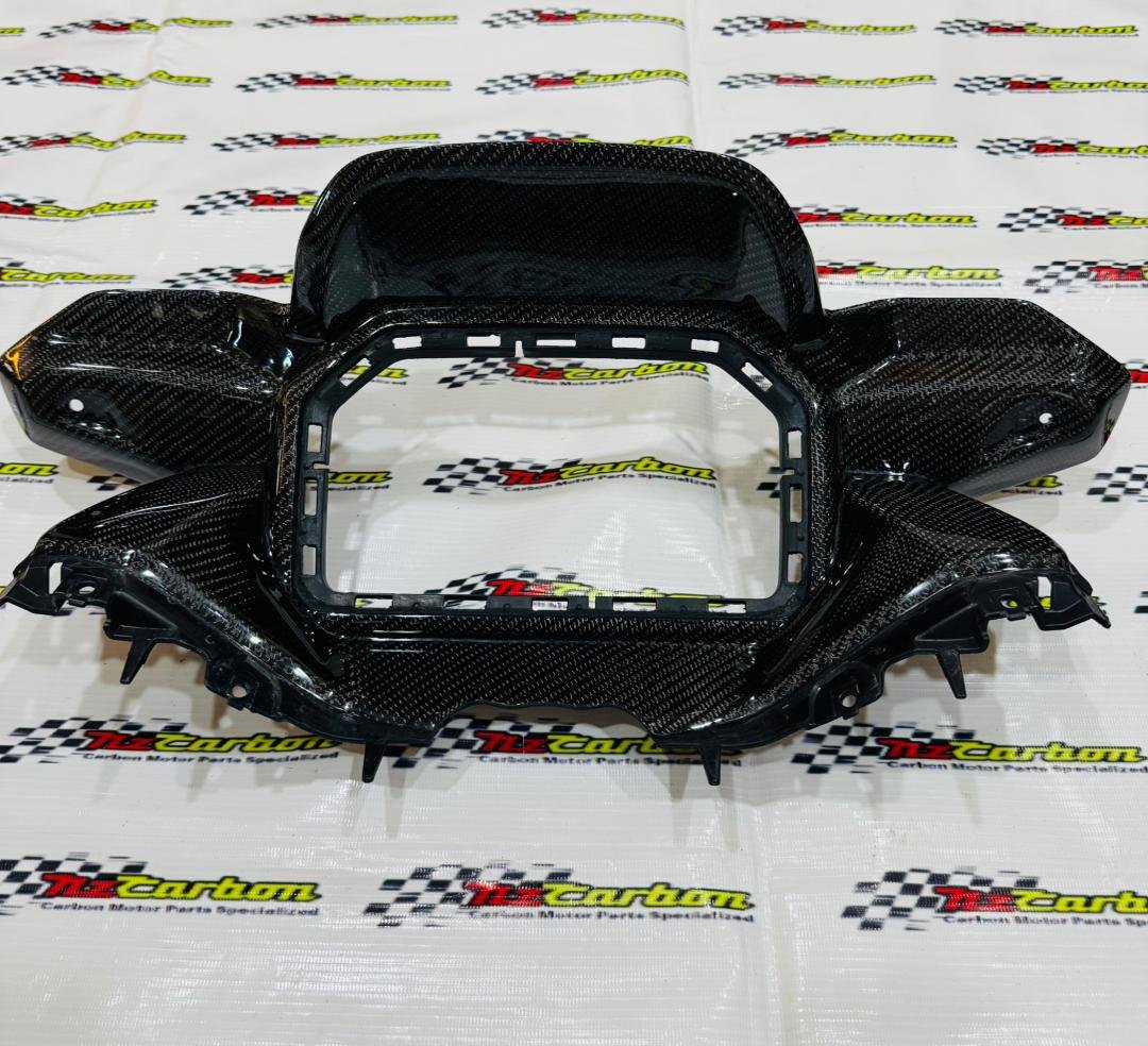 Black Twill Carbon Cover Meter Panel for Yamaha XMAX V3, displayed on an NZ Carbon background showing the detailed carbon weave and curved design.